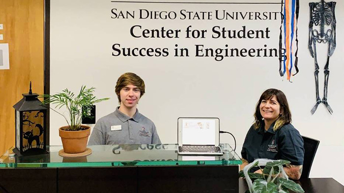 Staff welcoming visitors at the SDSU Center for Student Success in Engineering front desk.